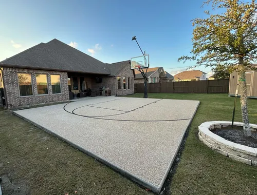 Backyard basketball court with TPV rubber surfacing and painted court lines